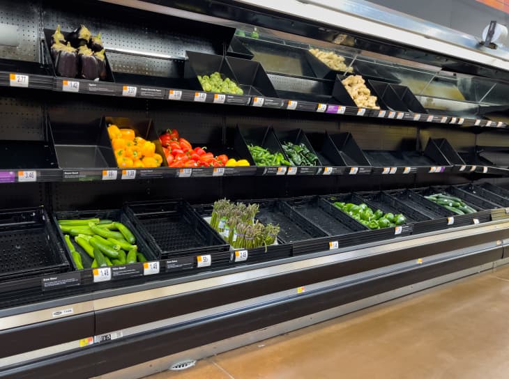 ATLANTA, GEORGIA - NOVEMBER 30, 2021 : Empty grocery store produce vegetable shelves at an American supermarket.