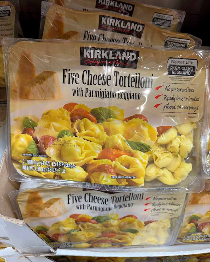 Packaged Five Cheese Tortelloni with Parmigiano Reggiano, featuring colorful pasta and serving suggestions.
