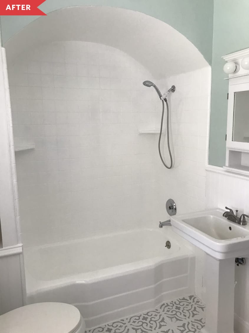 After: White painted tile shower with blue walls