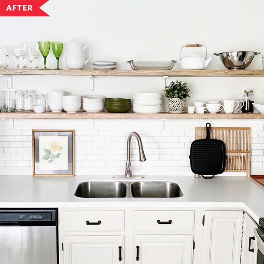 After: White base cabinets with long open wood shelves filled with dishware