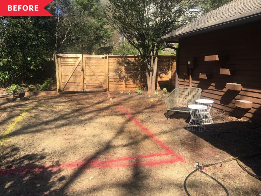 Before: empty backyard with dirt in place of grass and no seating