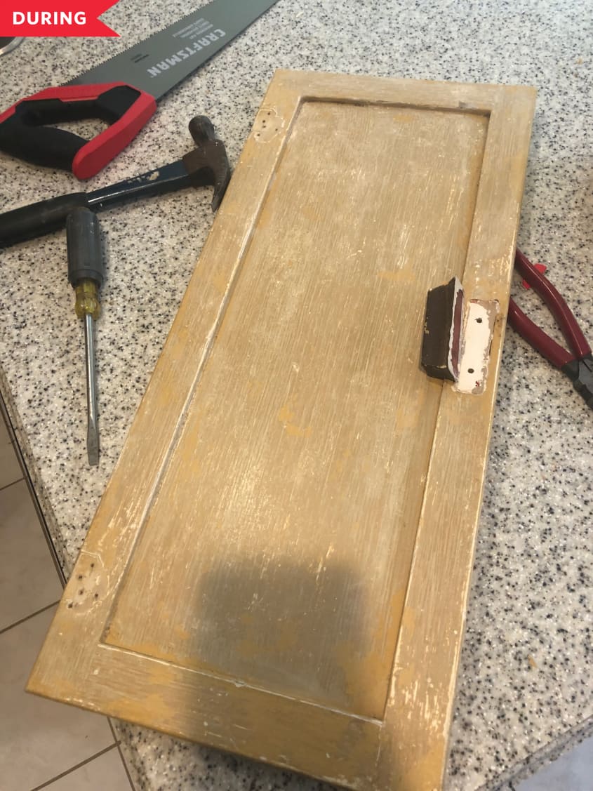 During: Taking off the old hinges on the doors