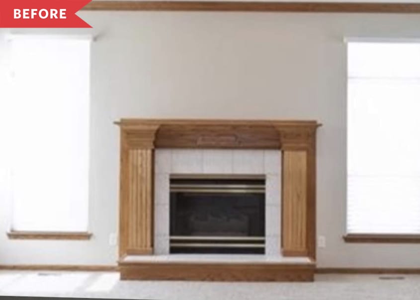 Before: Fireplace with beige tile surround and oak mantle against white wall