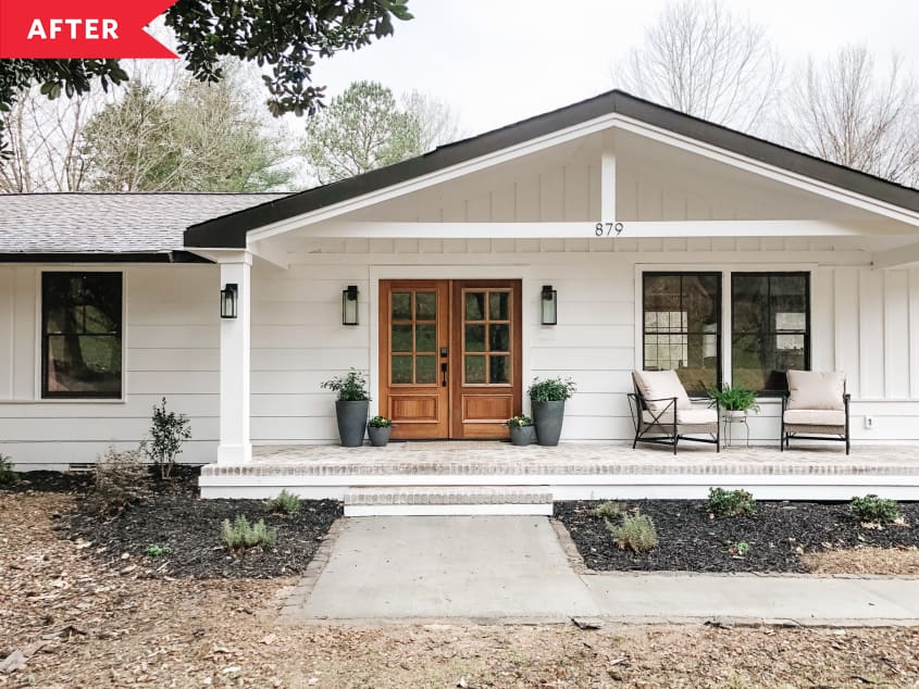 After: Home exterior with widened front porch and stained wood doors