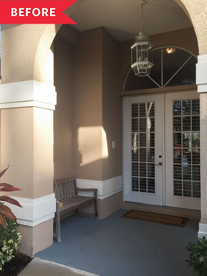 Front porch with white doors and tan walls