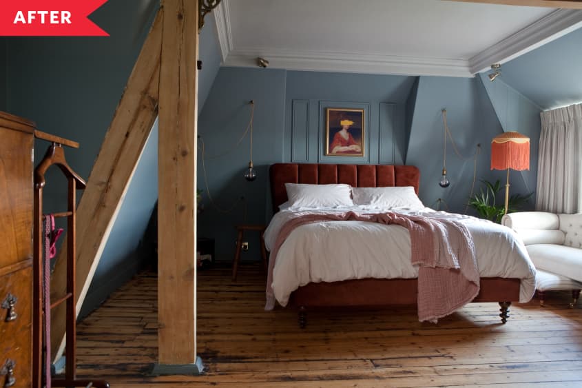 After: Blue bedroom with refinished wood floors and luxe red velvet bedframe