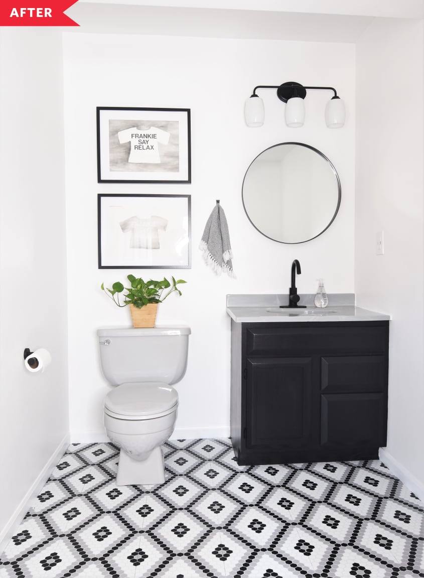 After: Bathroom with faux hex tile floors, a black vanity, white walls, and modern lighting