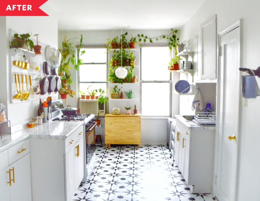 After: Kitchen with white cabinets, faux marble counters, and black and white floor
