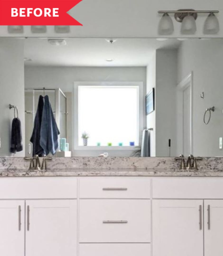 Before: Bathroom with sheet mirror, white cabinets, and gray stone countertops