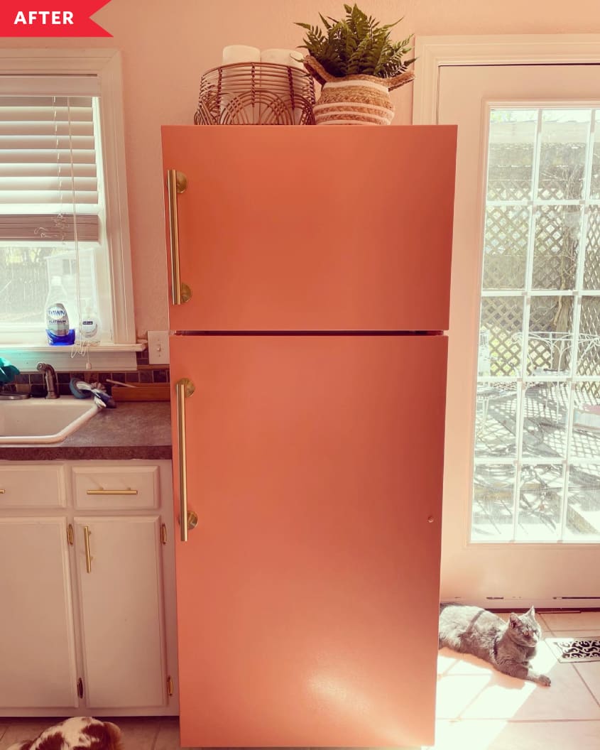 After: coral-painted fridge with gold pulls