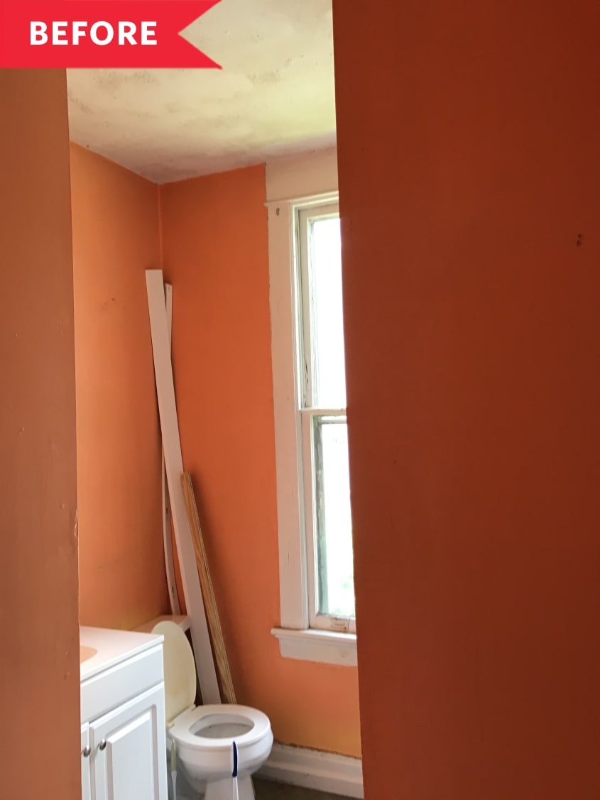 Before: Toilet in corner of bathroom with orange walls