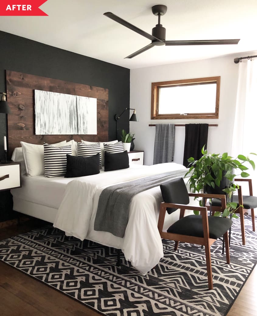 After: White bedroom with black accent wall behind a dark wood headboard, plus a black ceiling fan and a black and white area rug