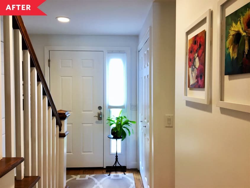 After: Open staircase with white and wood newel posts and modern white spindles, view facing front door