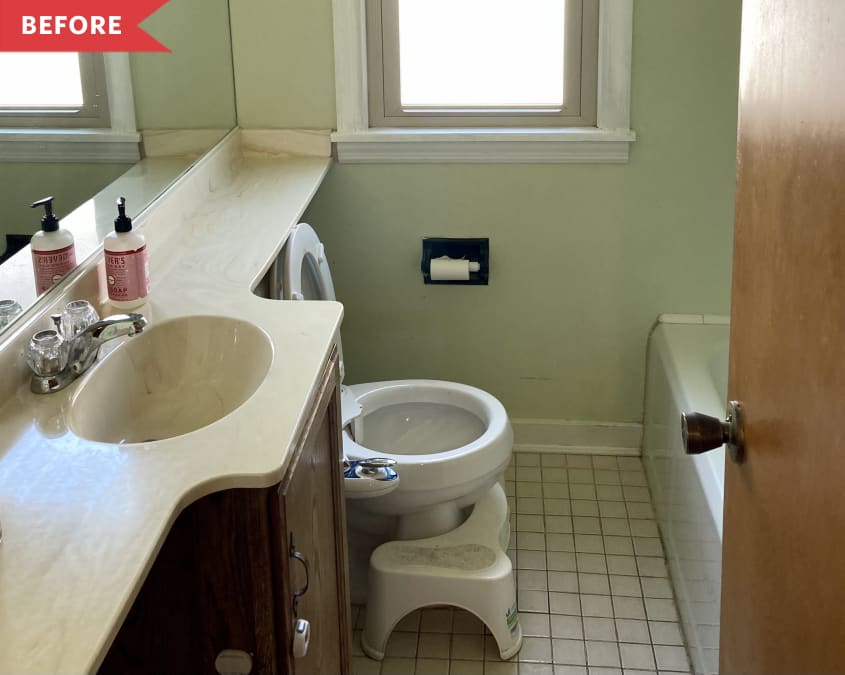 Before: Bathroom with pale green walls and dated vanity and door