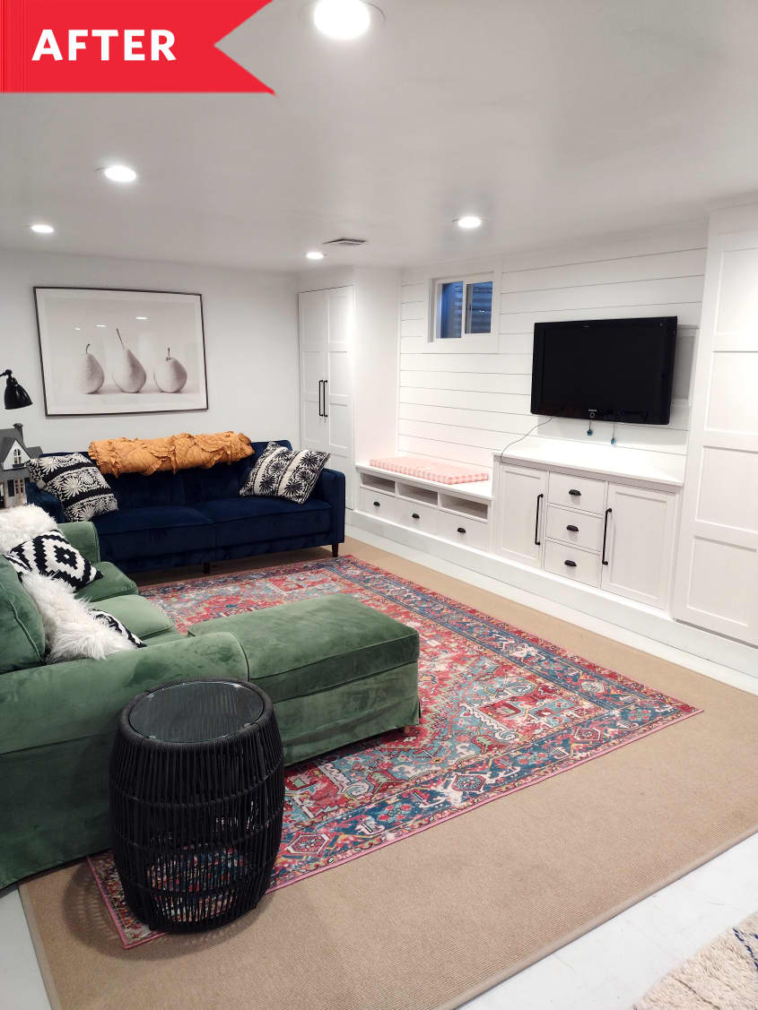 After: Basement with white built-in IKEA storage and green sofa