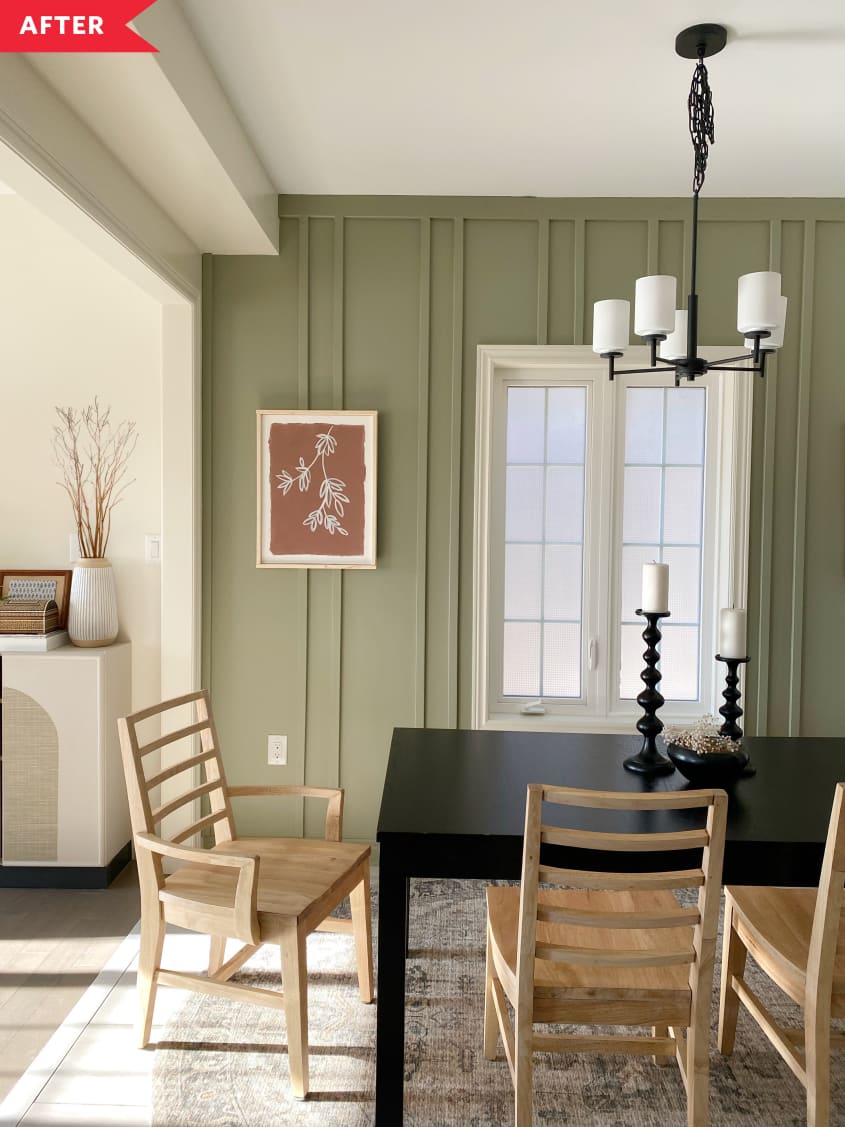 After: Dining room with green walls with wood moulding, black table, wood chairs, and modern black chandelier