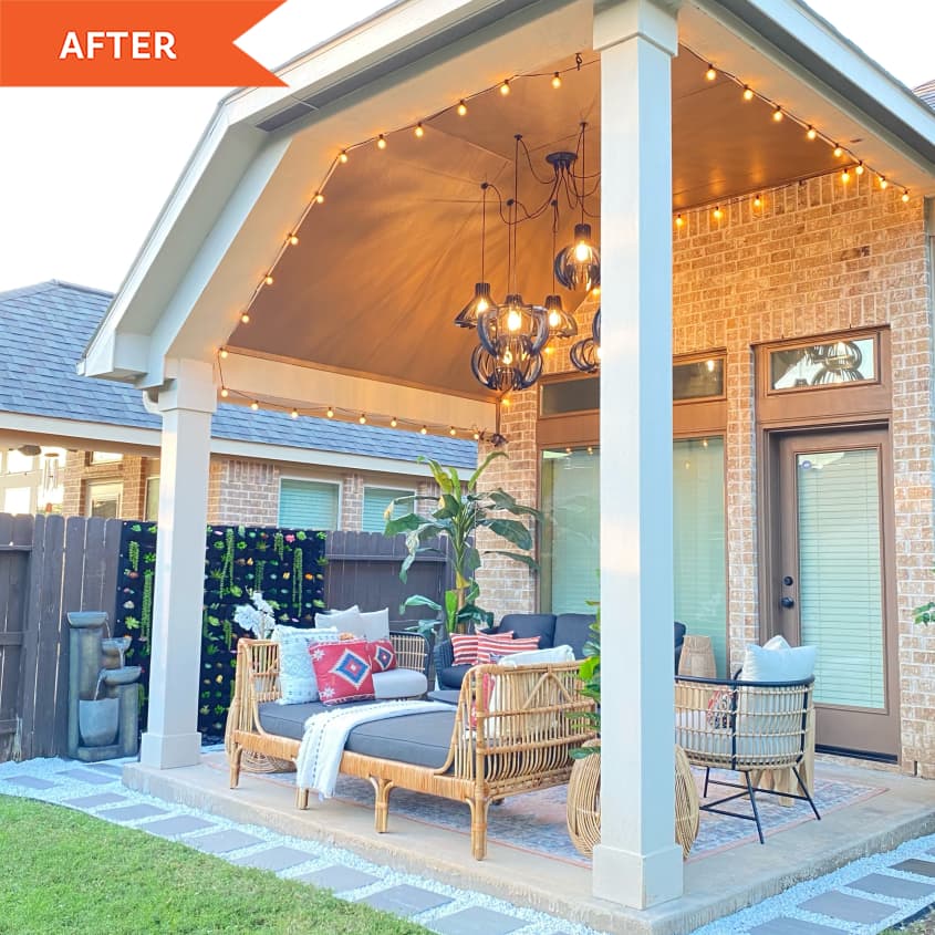 After: lit up covered patio with columns and wicker furniture