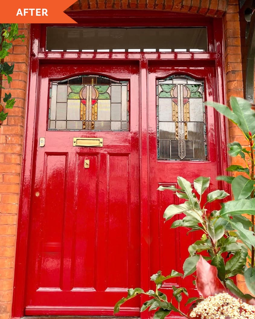 After: Brick house with red front door and stained-glass windows