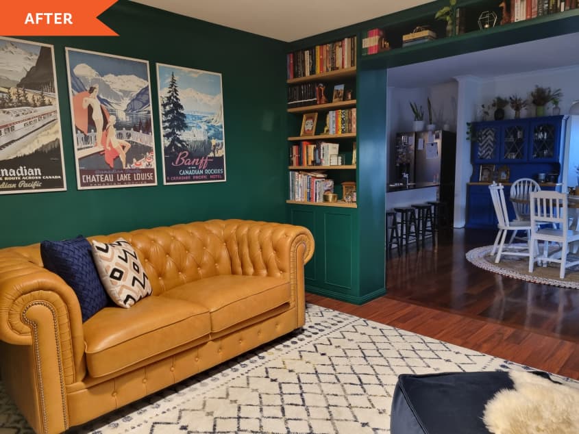 After: leather couch in a green living room with built in bookshelves and art on the wall