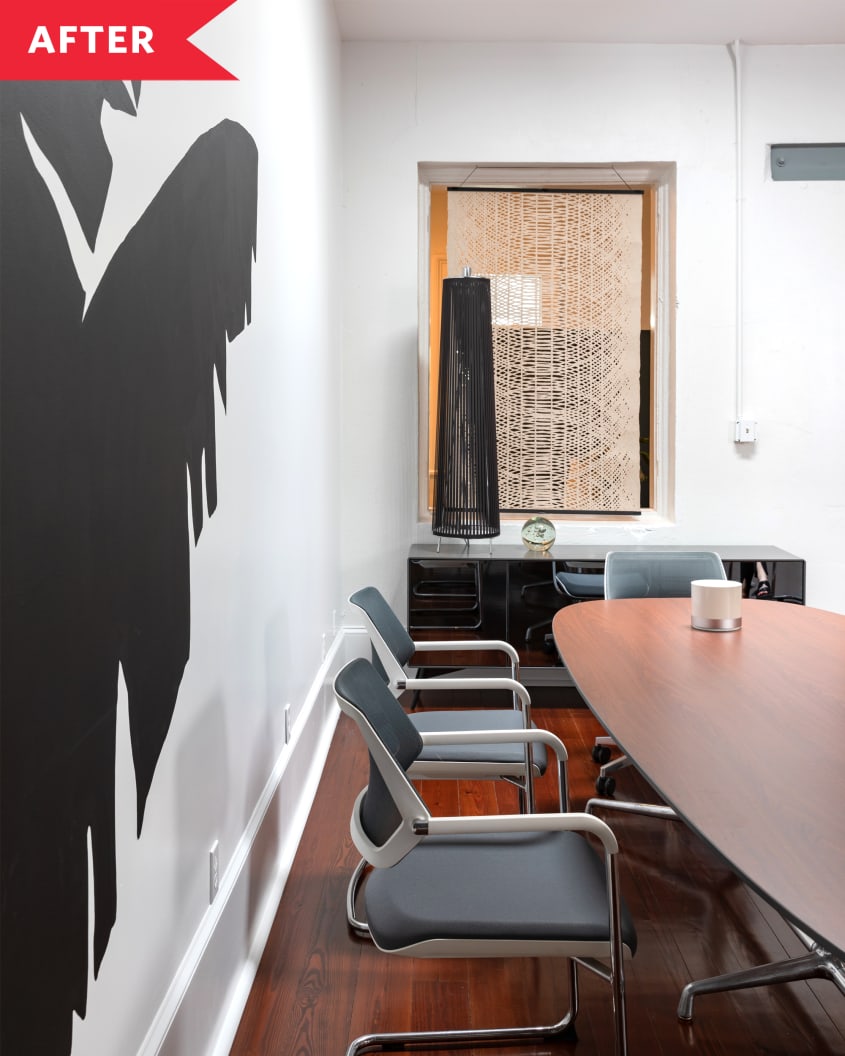 office space with plants painted on walls after renovations