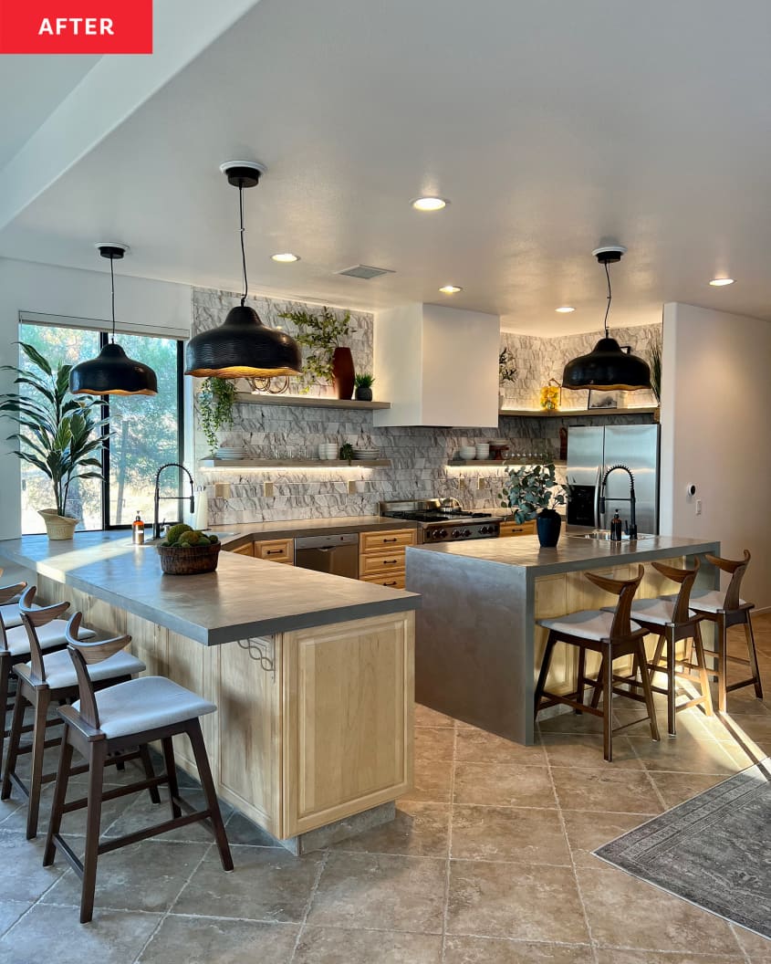 After: a large kitchen with chairs at a counter and at an island and hanging lights