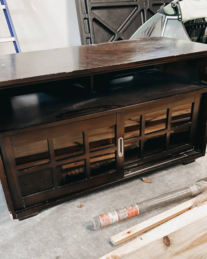 used dark wood dresser before being refurbished