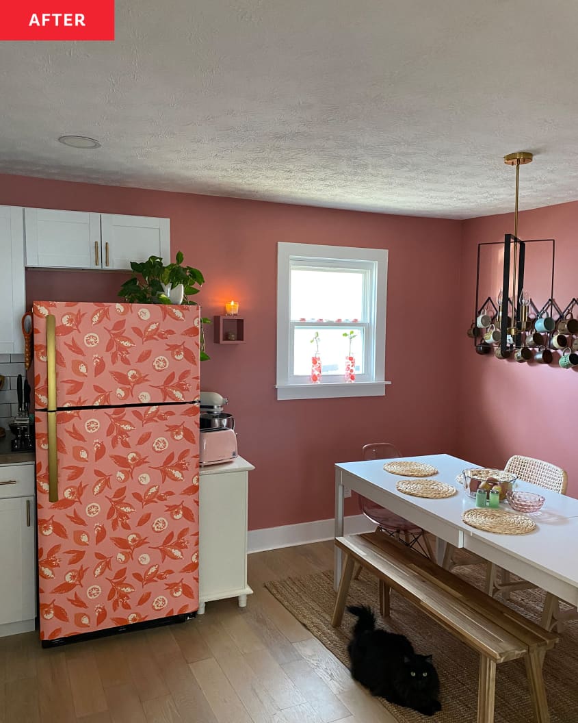 After: Pink dining room and kitchen. Kitchen has fridge covered in pink floral wallpaper