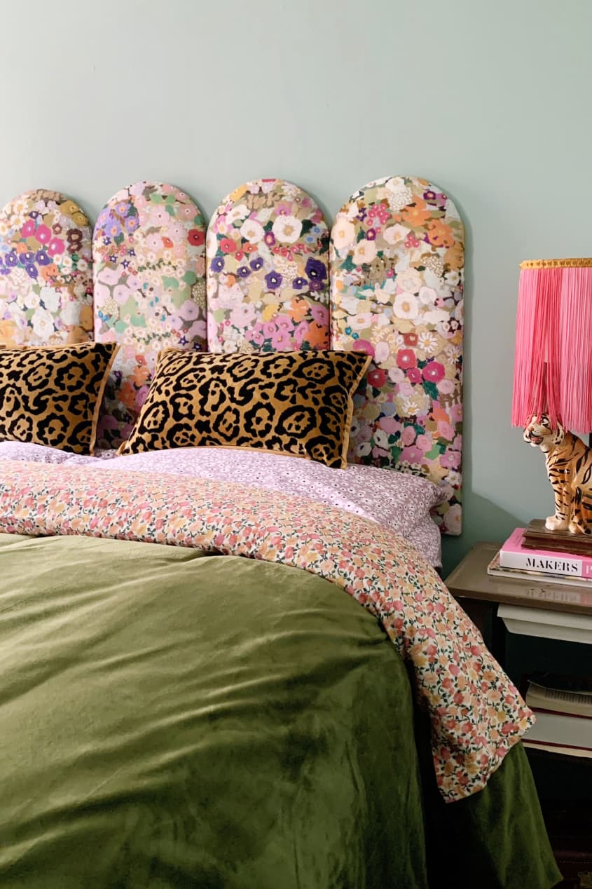 bed with floral upholstered headboard