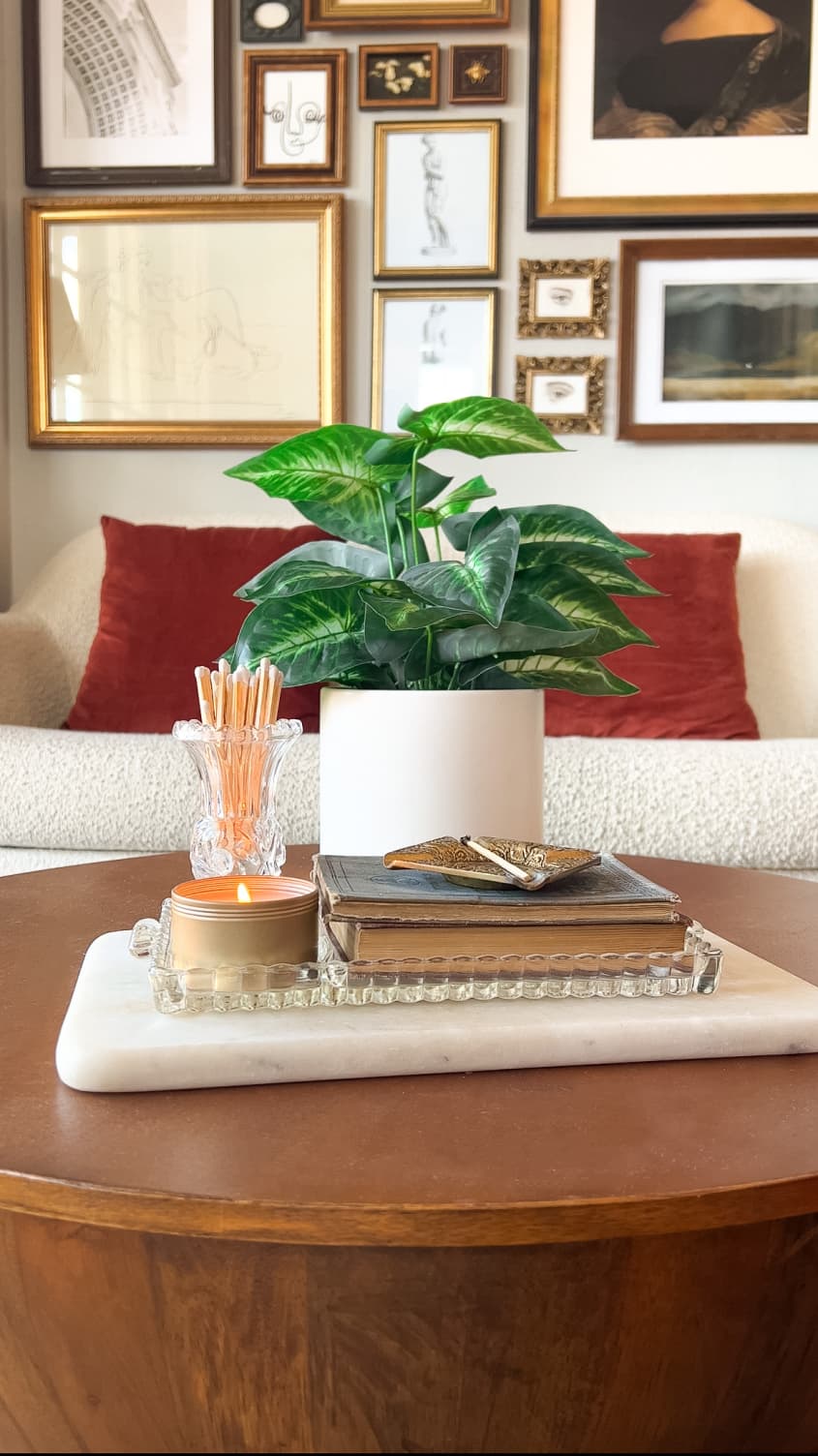 Small glass vase holding matches on coffee table