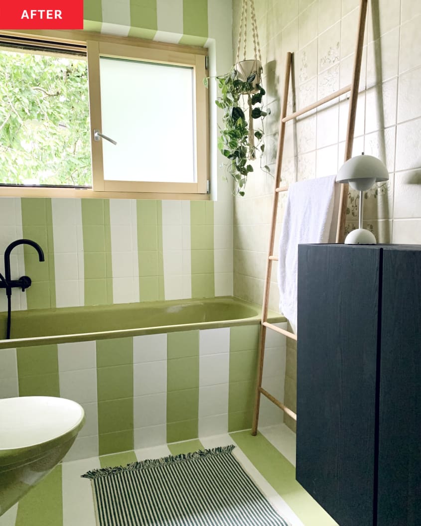 After: Close-up of tub in green and white striped bathroom