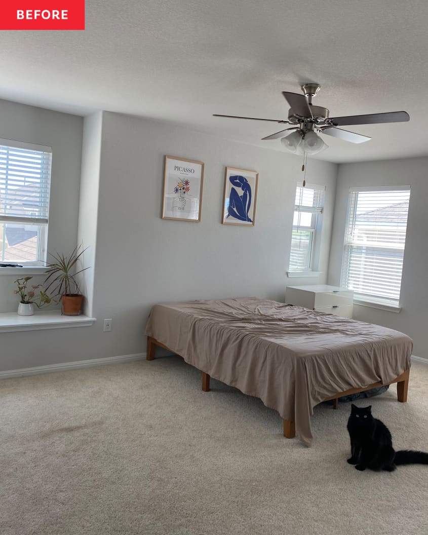 Bedroom with two posters on wall before renovating.