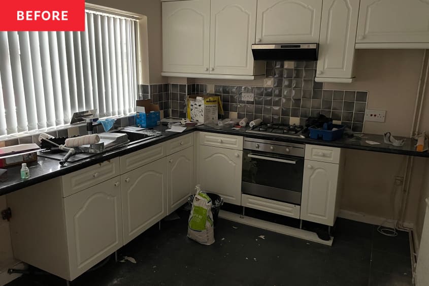 Messy dark kitchen before renovation.