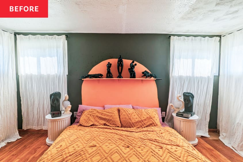 Peach oblong decal painted on green wall behind bed with figurines on matching peach painted shelf in bedroom with neatly made bed and two pillar nightstands on either side of bed before renovation.