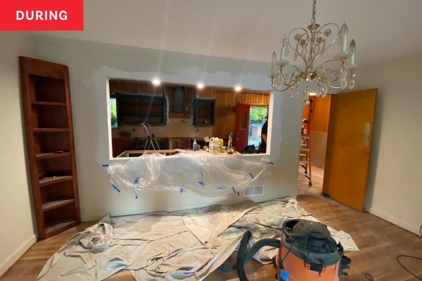 During: Tarps laid out in the kitchen and dining room