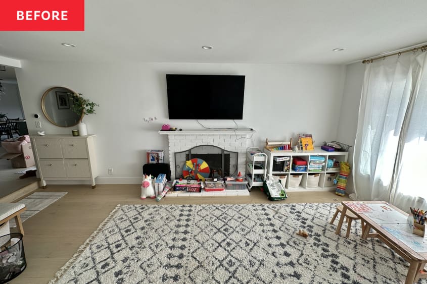 Before: Cluttered playroom with brick fireplace