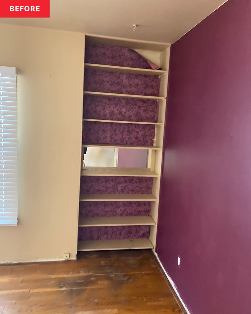 Purple wallpaper mounted on back wall of built in living room shelves before renovation.