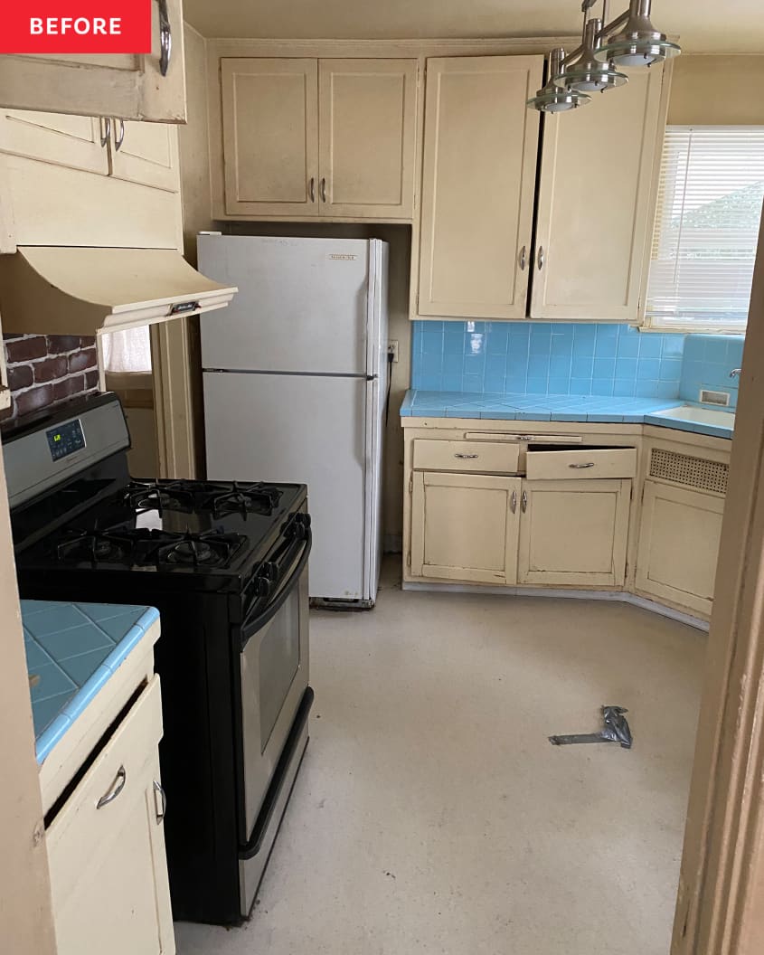 Outdated and damaged kitchen with blue tile countertops, cream colored cabinets and mix matched appliances before renovation.