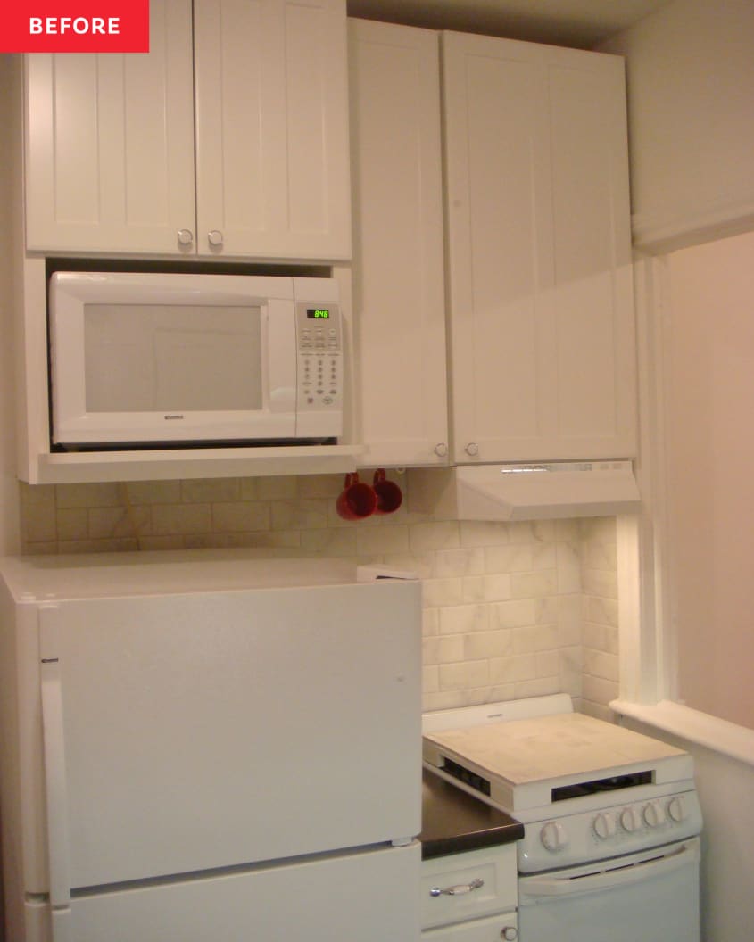 Small stove, countertop and fridge in a kitchen with microwave mounted above refrigerator before renovation.