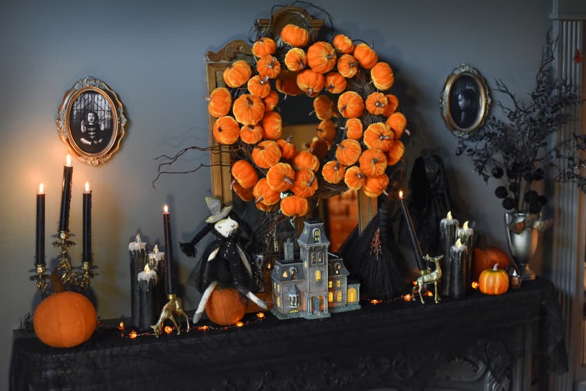 Halloween decor on top of fireplace mantel.