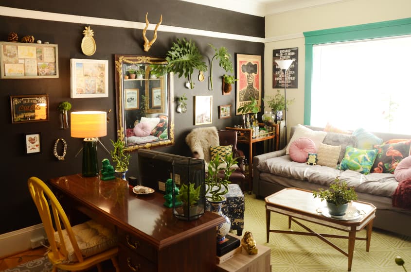 black living room with a maximalist aesthetic