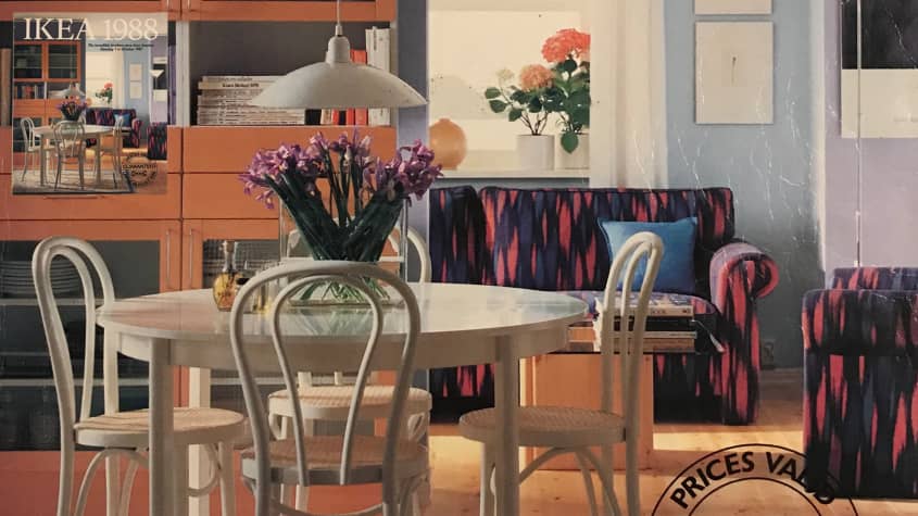 IKEA catalog cover from 1988 with white dining table and colorful sofas in background