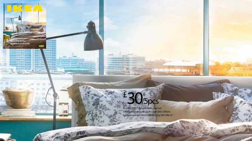 IKEA catalog cover from 2014 with bed in front of windows overlooking city