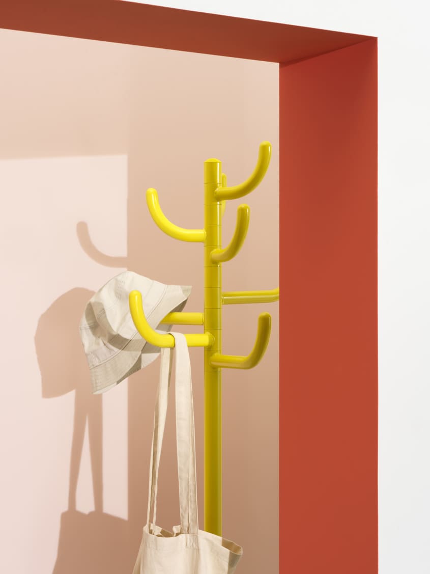 Colorful studio photo of items from the IKEA 80th anniversary Nytillverkad collection - yellow coat/hat tree