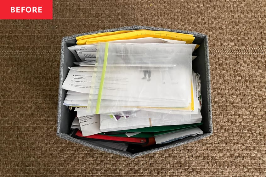 Damaged file box with unorganized paper files inside