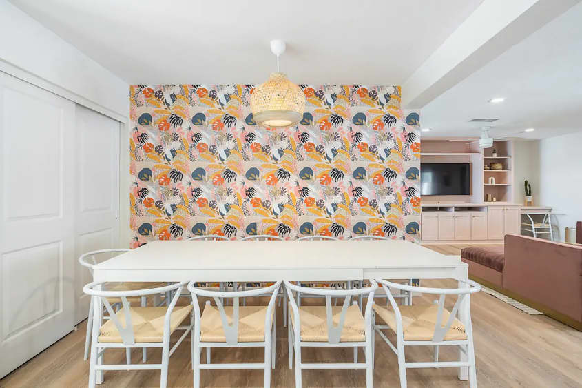 Yellow wall paper in dining area of bachelorette party house.