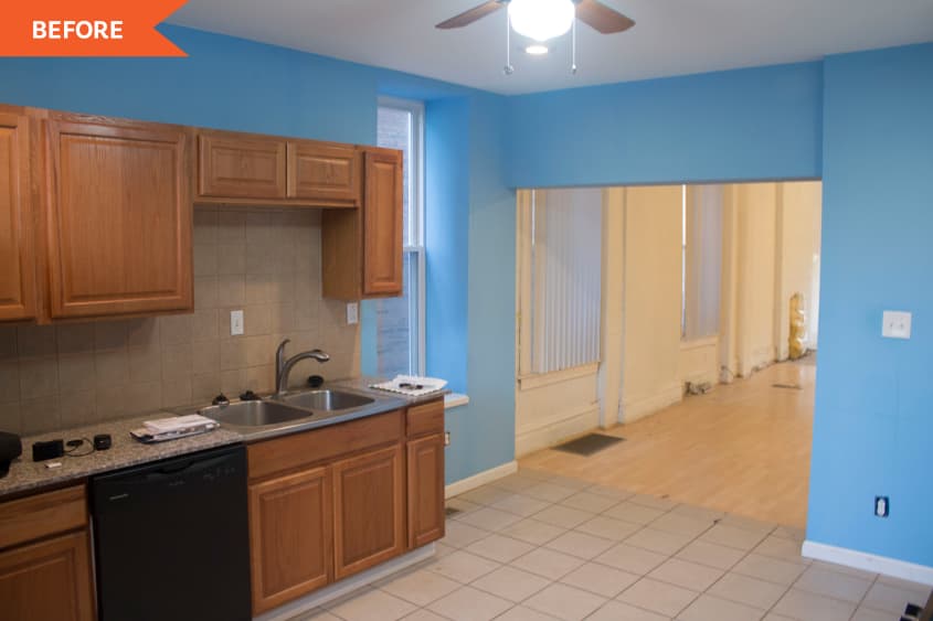 Kitchen before with wood cabinetry and blue walls