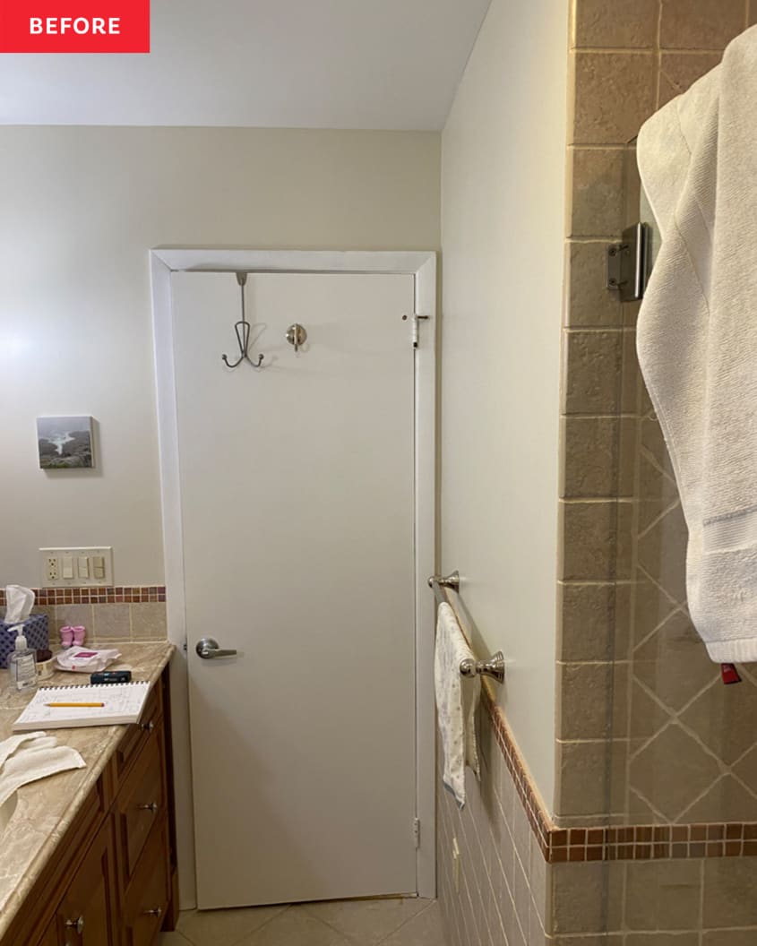 Bathroom before renovation/makeover: outdated marble-look countertop and wood cabinets, brownish gray tiles on lower half of wall and in shower, drab warm gray tile floor