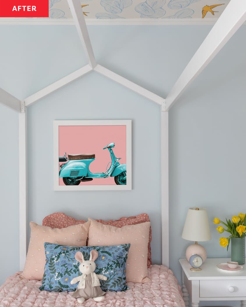 4 poster bed, canopy bed, pink textured comforter, yellow tulips, blue vespa graphic art, bunny stuffed animal, pink pillows, light blue walls, yellow bird and cloud wallpaper on ceiling, small side table, small lamp, blue throw pillow