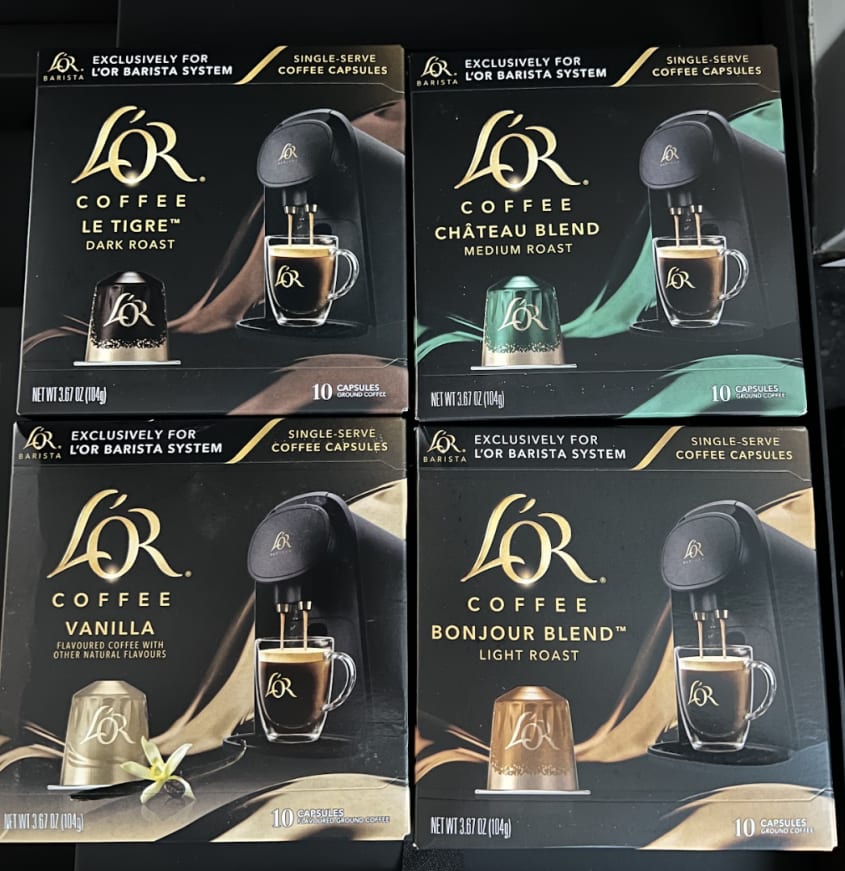 four boxes of coffee capsules by L'OR