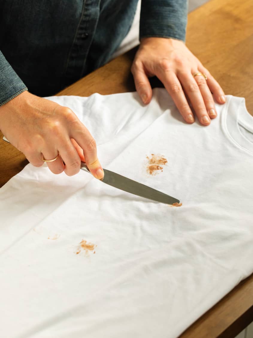 Removing chocolate from white t-shirt.